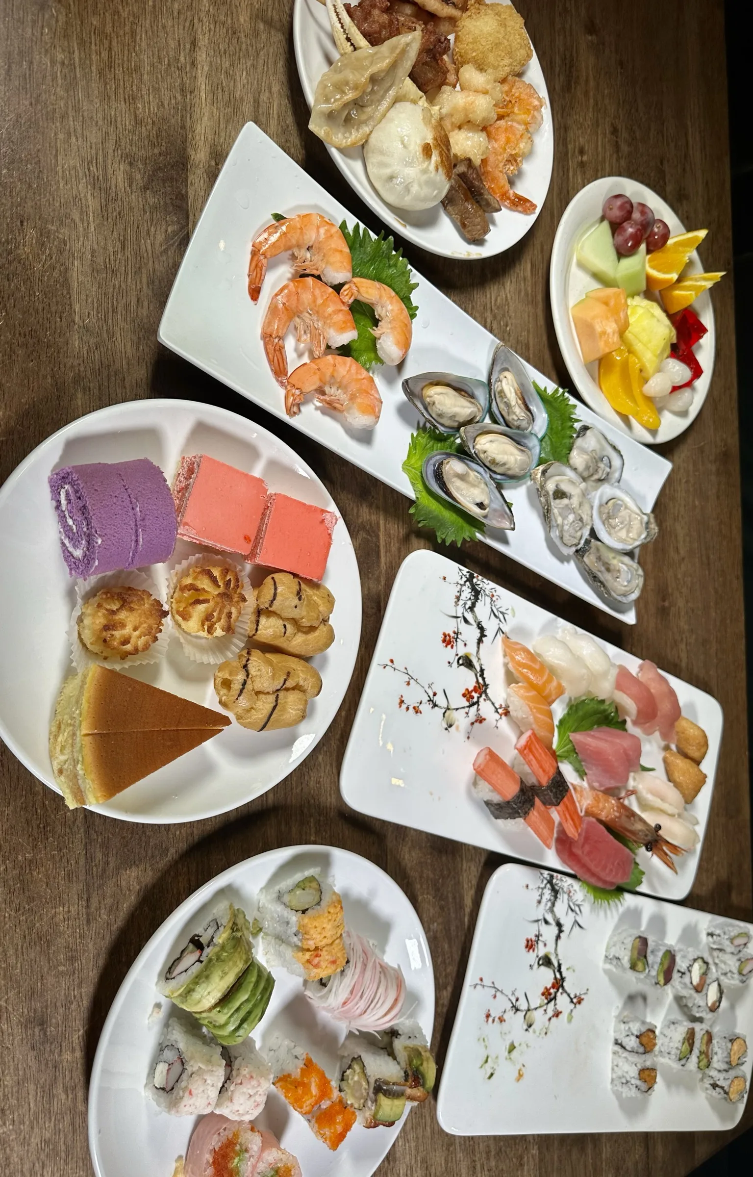 Overhead view of sushi rolls, oysters, nigiri, and oysters on the half shell at Kumo Ultimate, Stamford CT